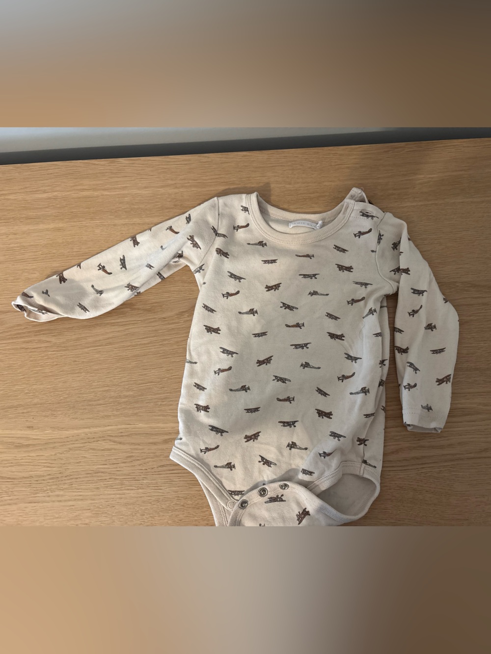 Jaime Kay 1T Bodysuit in Cream with Airplane Print